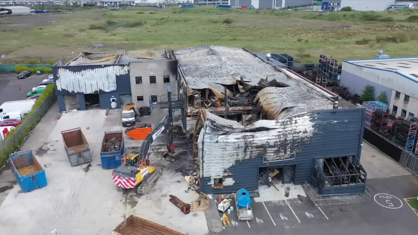 Commercial loss assessor reviewing a damaged business premises with the owner